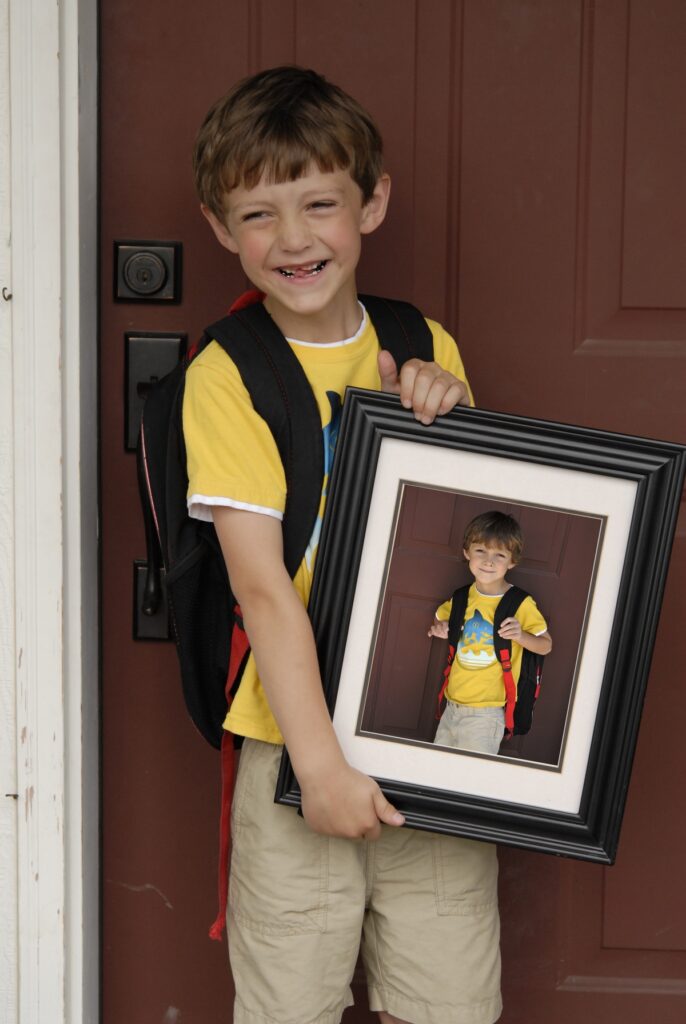 a kid with a portrait of himself
