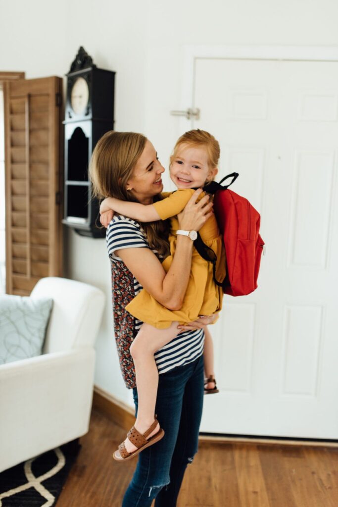 mom welcomes her child back from school