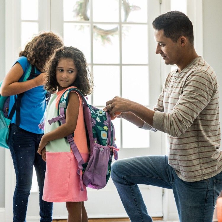 dad preparing kids for school