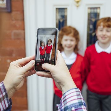 dad taking his kids picture