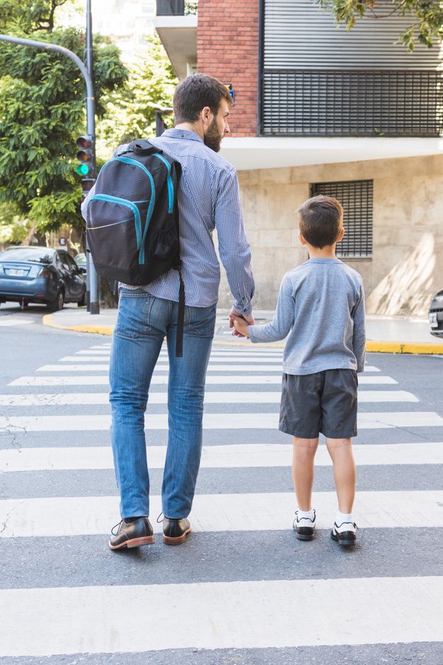 kid and his Dad walking to school first day of school photo idea