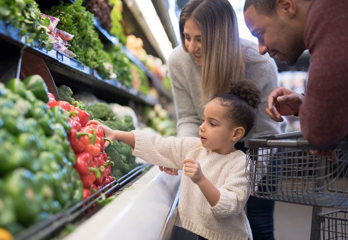 mom and kid shopping groceries