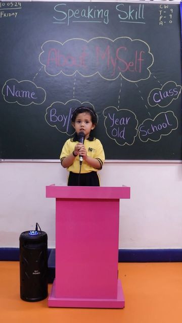 kid introducing her self in school