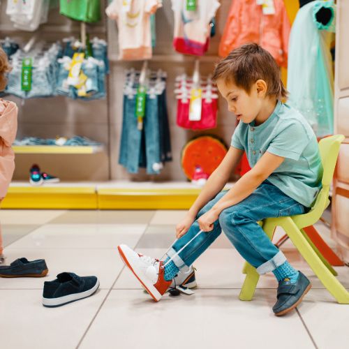 keep testing his school shoe to avoid back to school shopping mistake