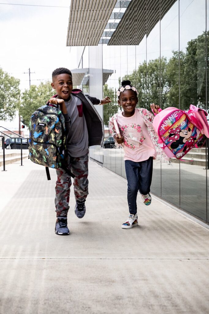 kids happily coming back from school