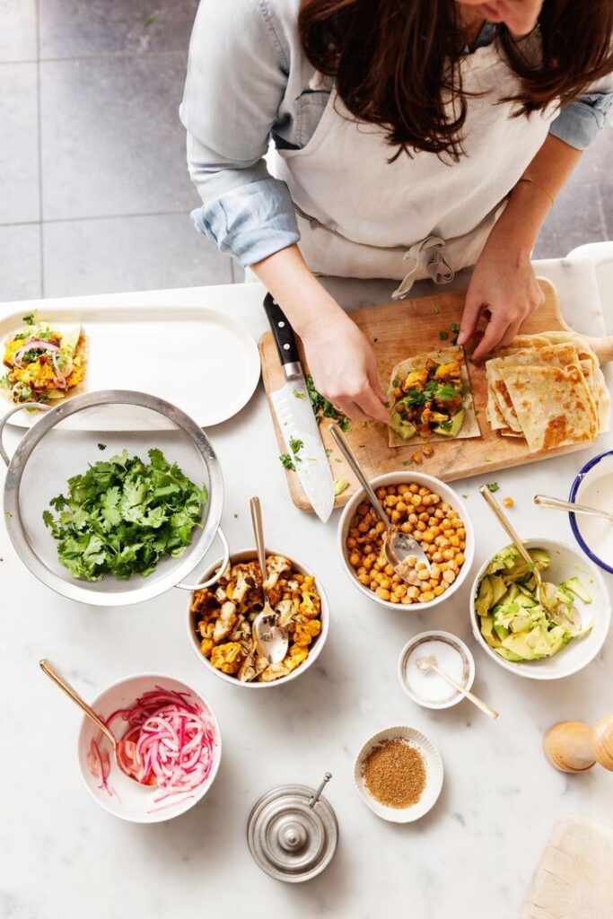 a mom cooking as school morning routine