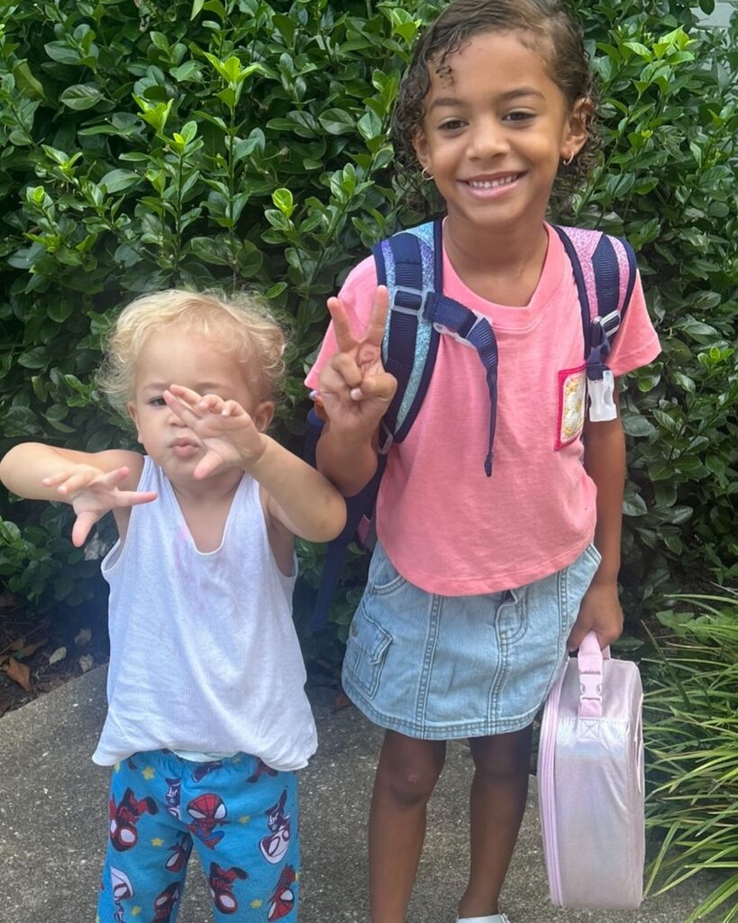 school kid with her little sibling