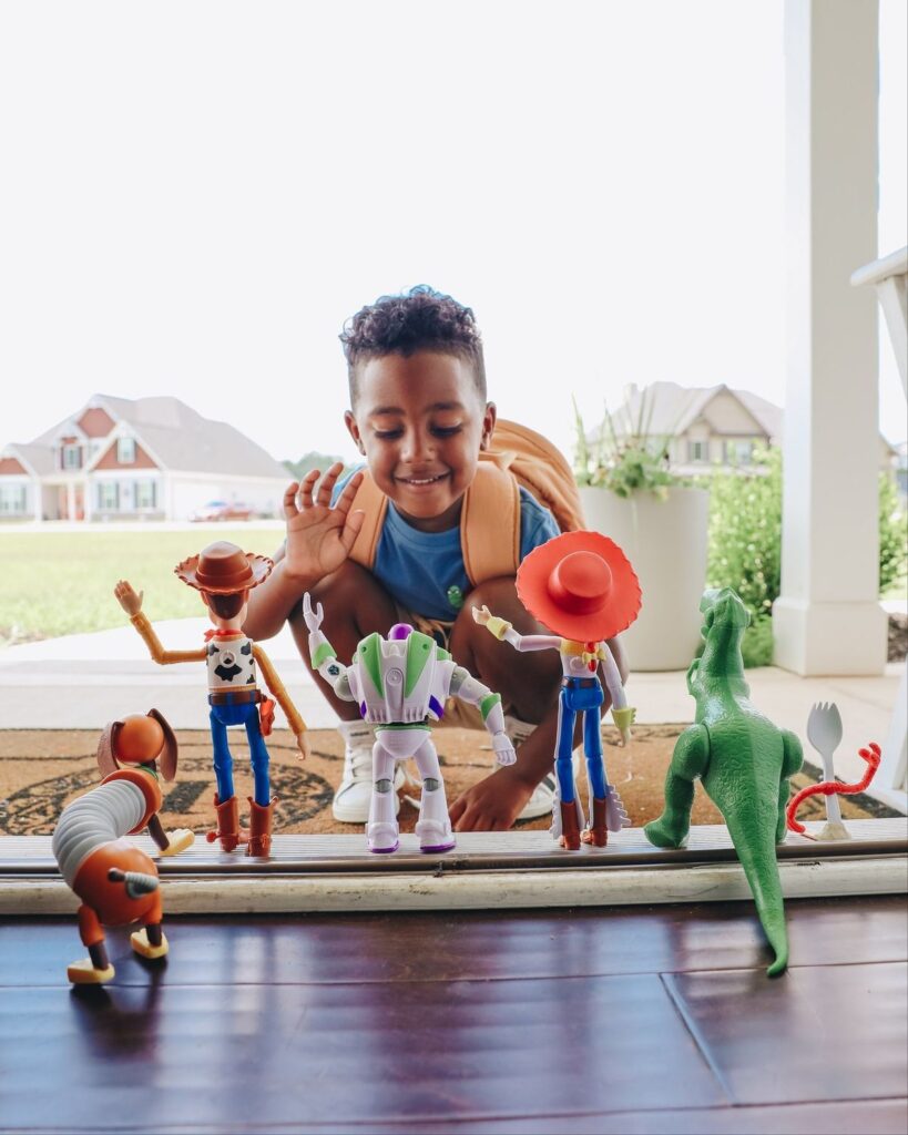 school kid with his toys