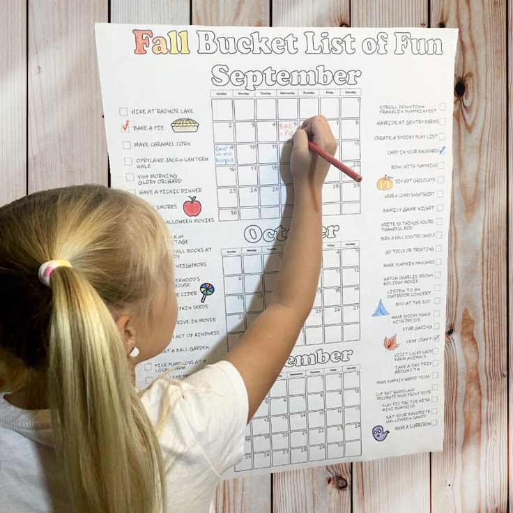 kid designing a family fall calendar