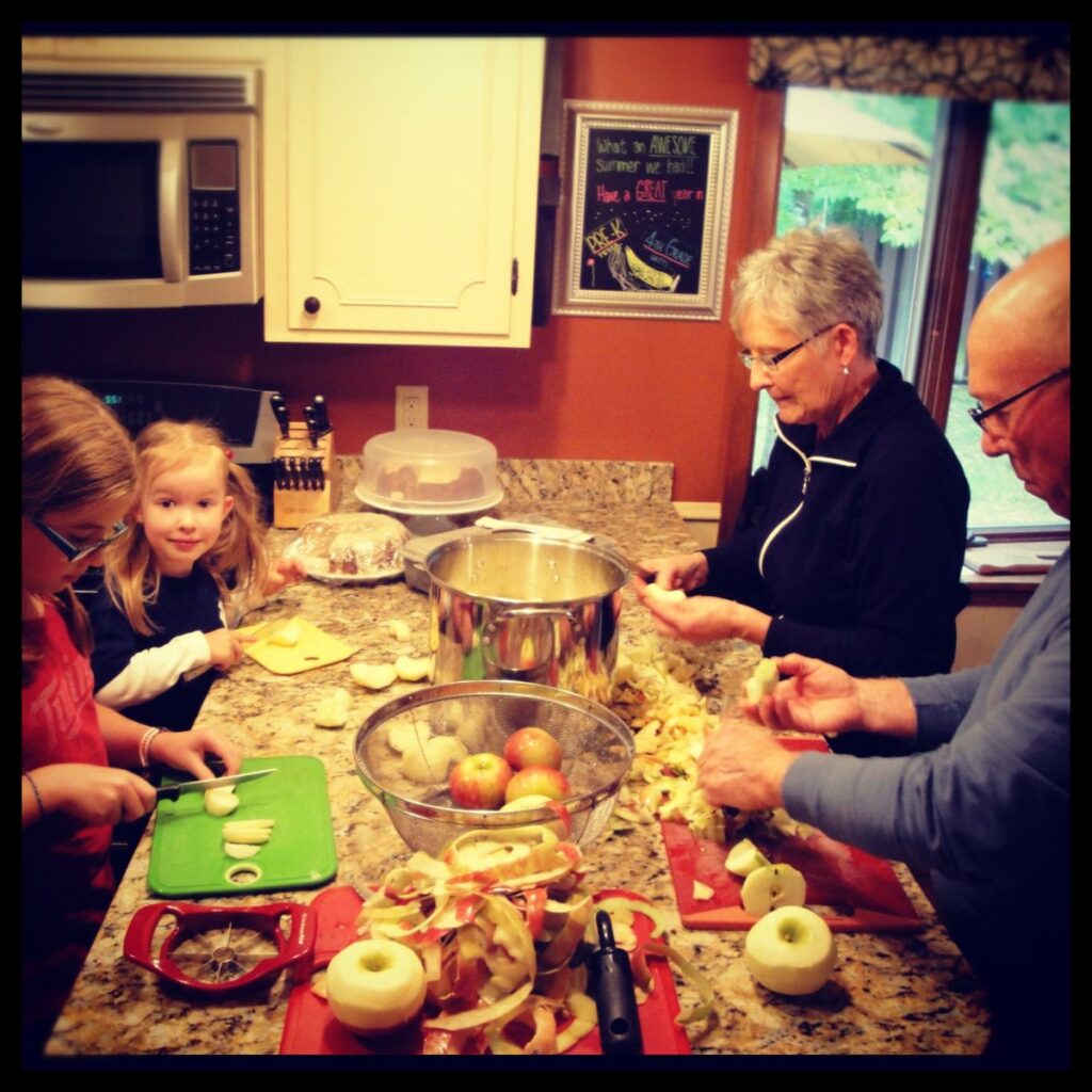 family making applesauce