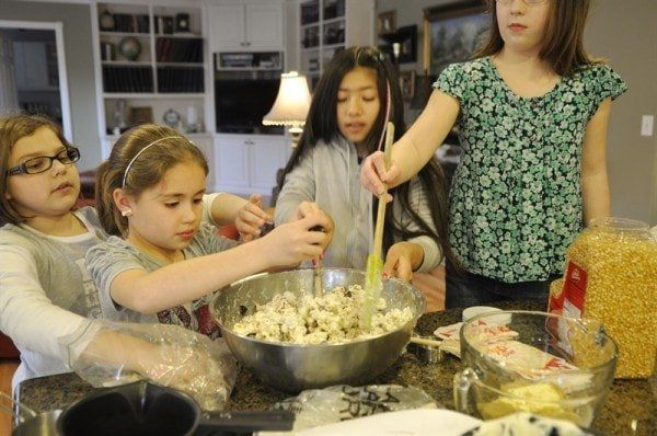 mom and kids making popcorn