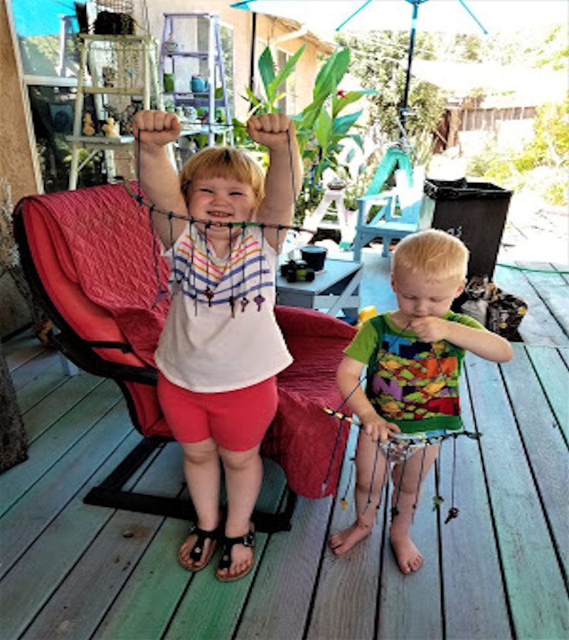 kids with fall wind chime