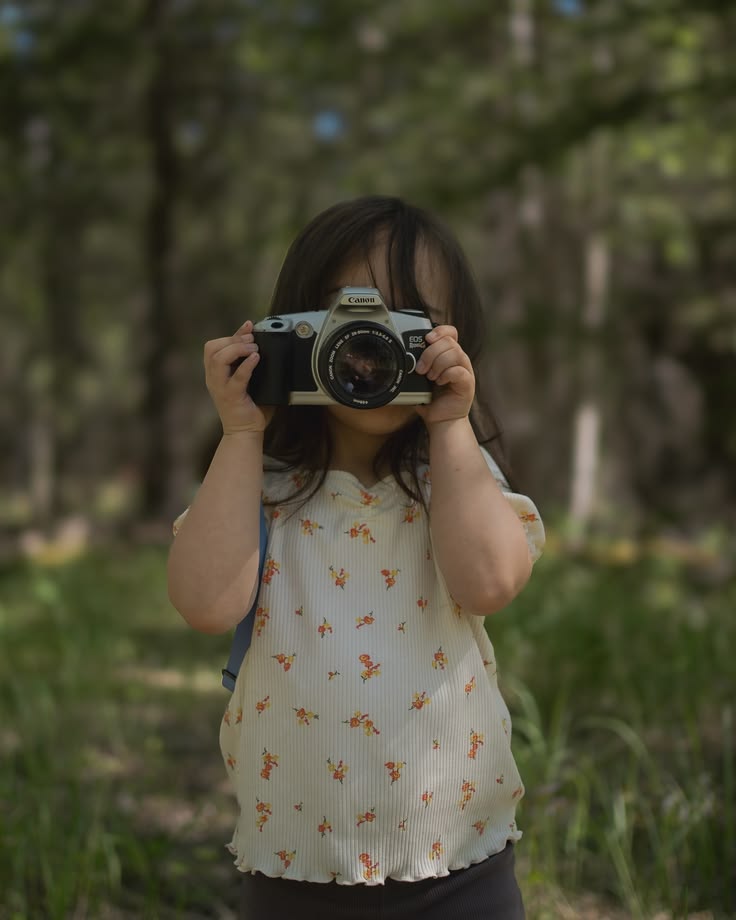 kid taking photo of nature