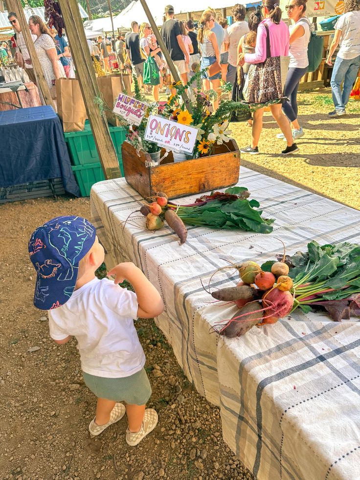 kid visiting the local farm stand as one of the fun fall activities for kids