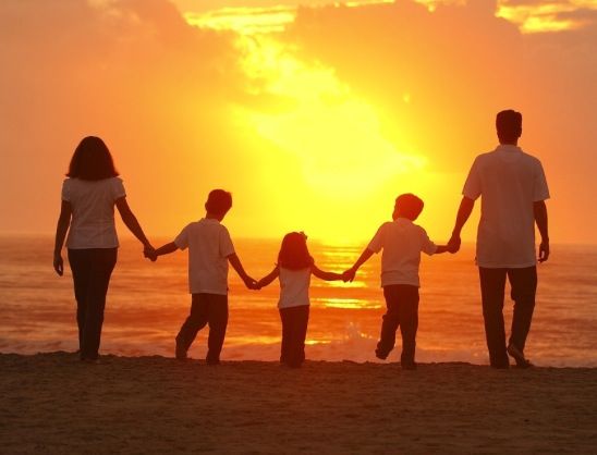 family watching sunset
