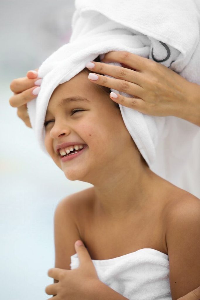 mom drying kid's hair