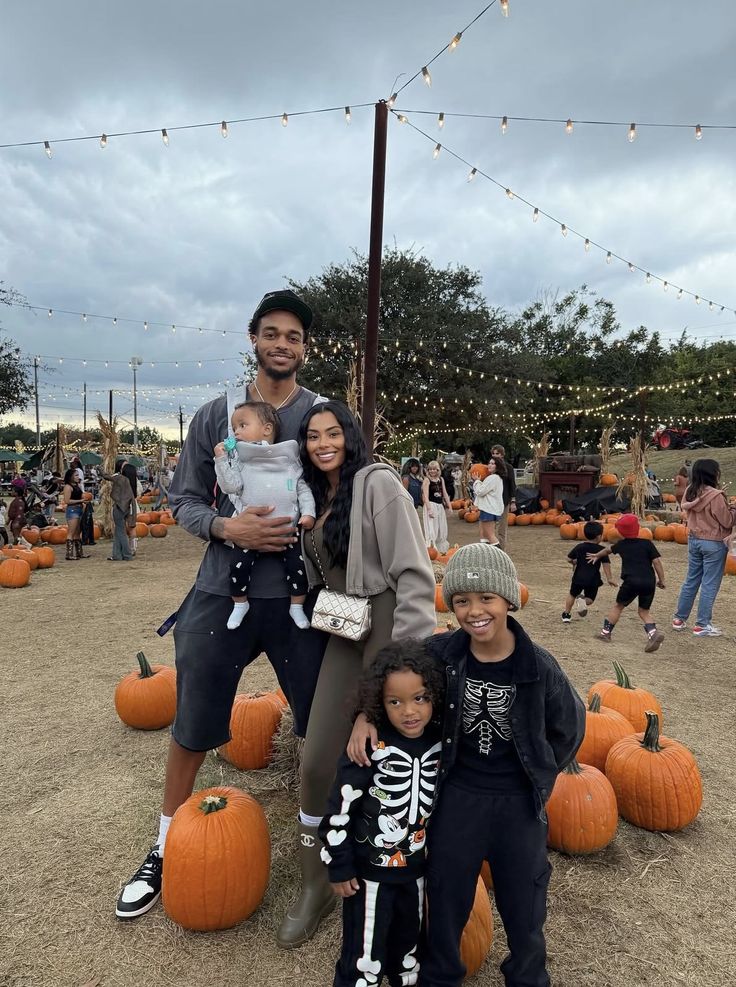 family enjoying the pumpkin patch