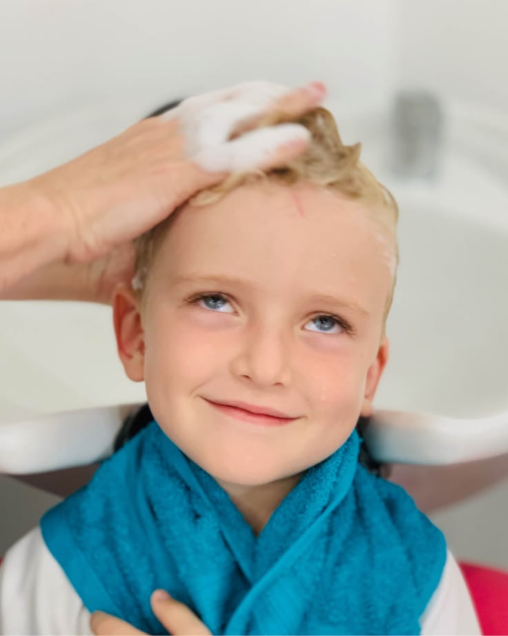 kid getting her hair washed