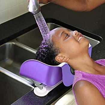 kid getting he hair washed
