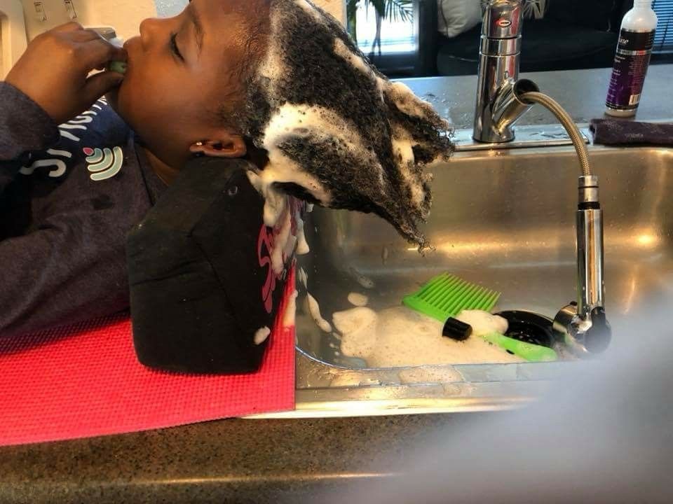 mom washing kid's hair