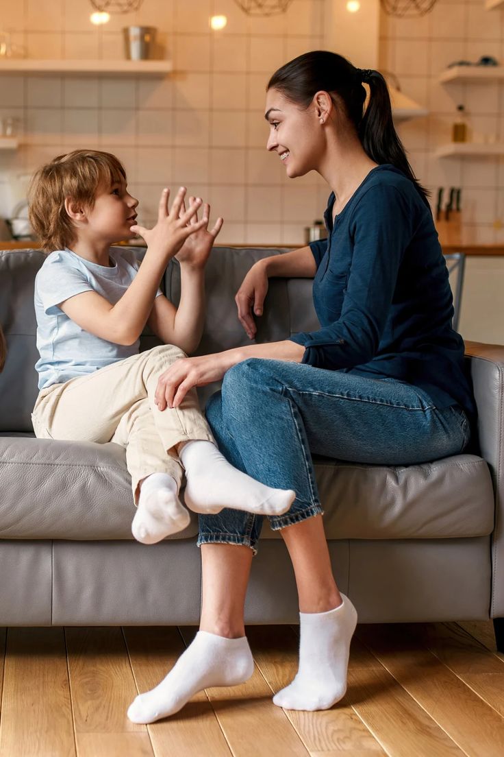 mom and kid having a conversation  before halloween as a way to make halloween less scary for kids