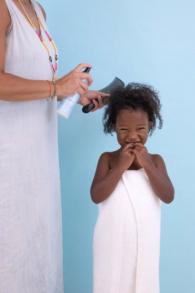 mom detangling her child's hair without tears