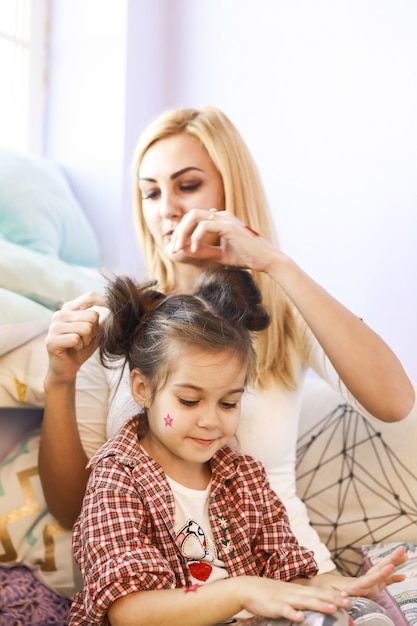 mom making her child's hair