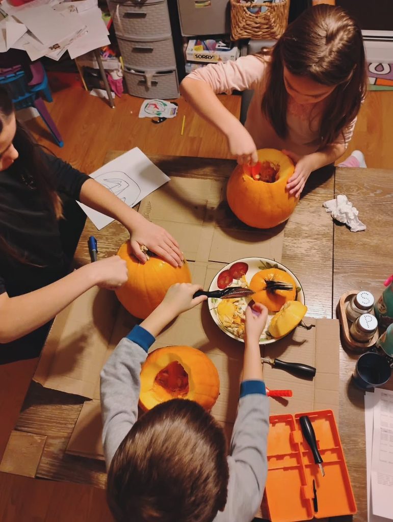 kids carving pumpkin