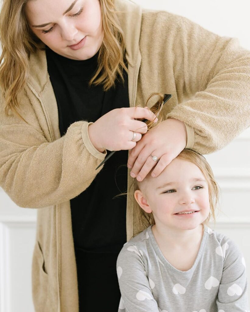 mom styling her child's hair