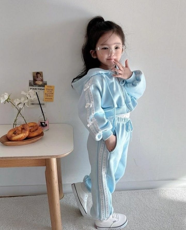 kid in athletic sets with zip up jackets as easy outfit ideas for busy school morning