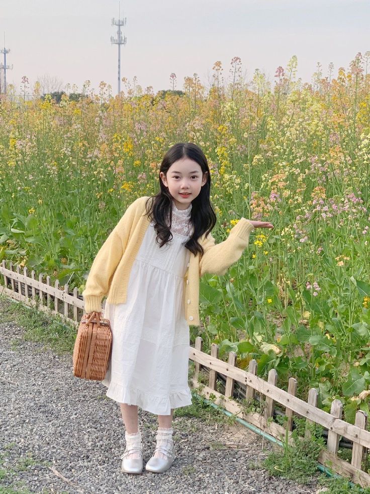 kid in basic cardigans over simple dresses