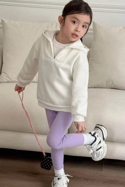 kid in leggings with a cropped hoodie
