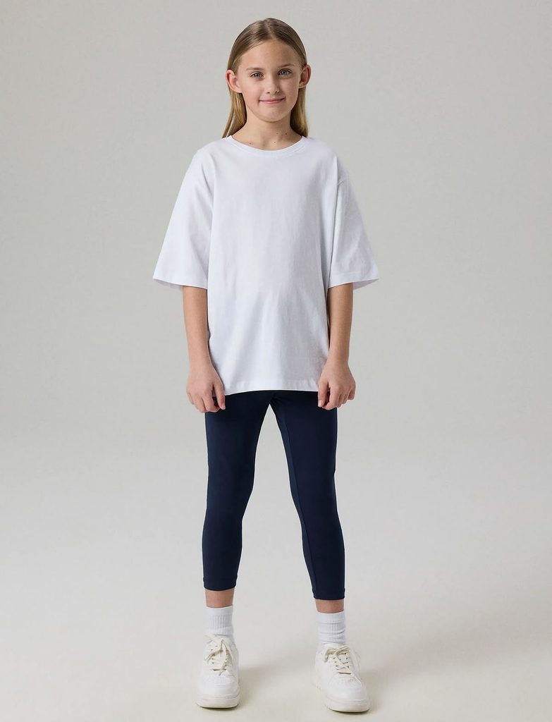 kid in basic leggings with an oversized tee