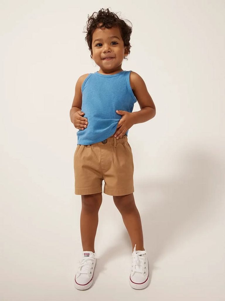 kid in a basic linen short with a tank