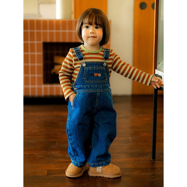 kid in basic pull overalls with a long sleeve top