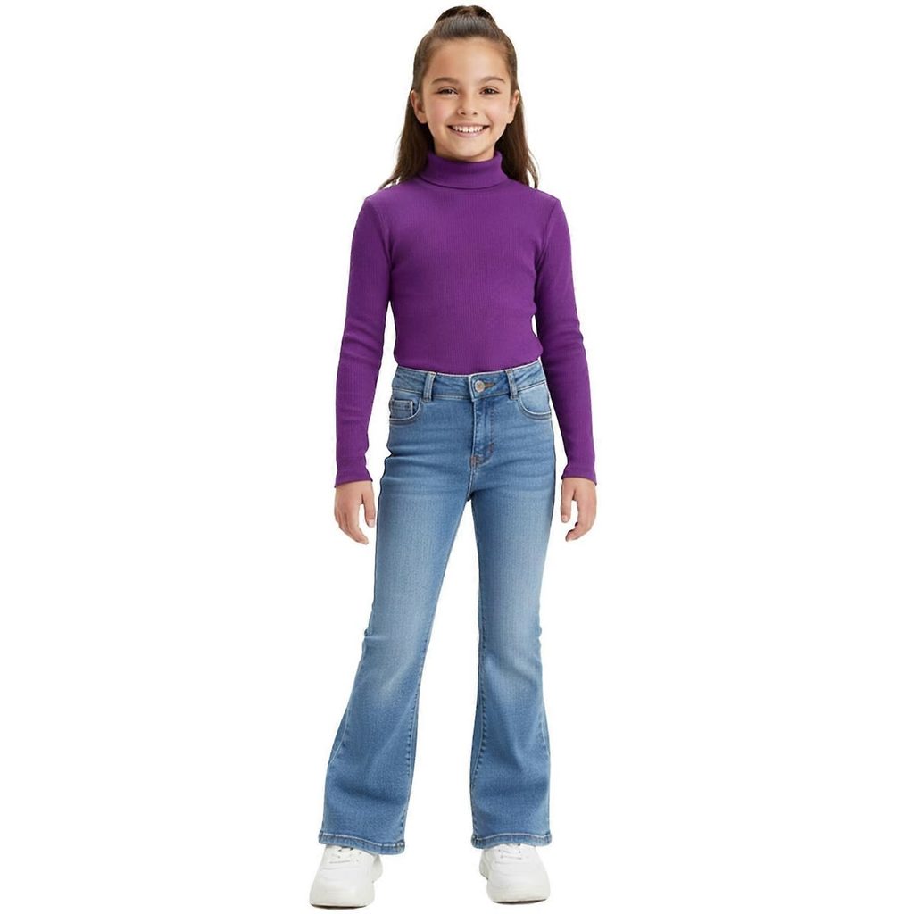 kid in bootcut jeans with a fitted turtled neck top