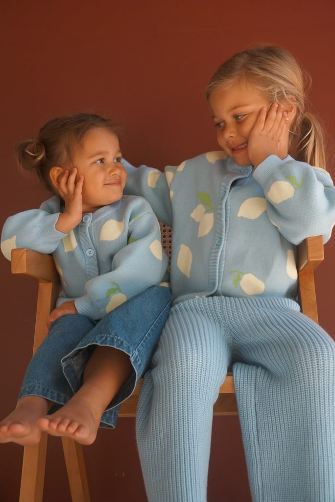 kids in matching cardigans