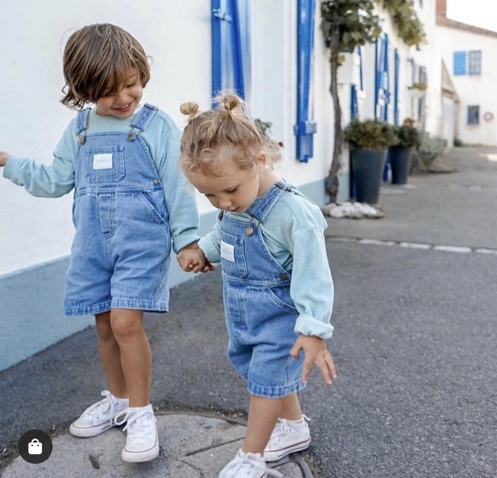 kids in denim overalls as matching outfit ideas for siblings