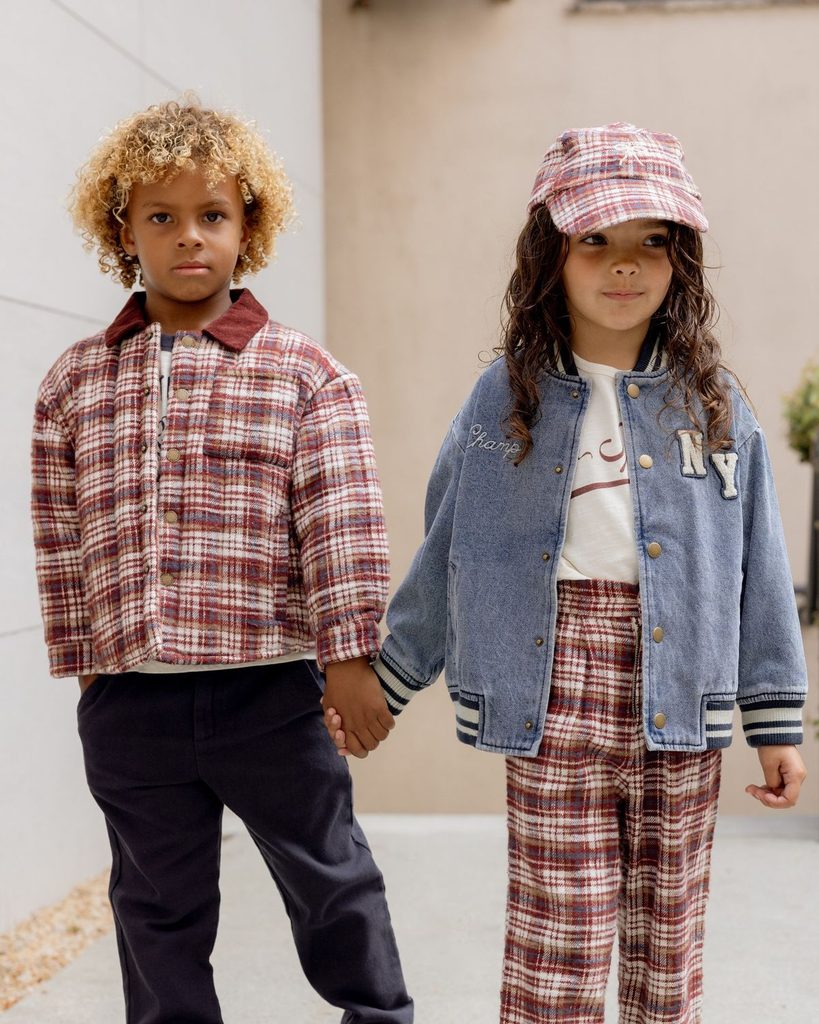 kids in coordinating plaid prints as matching outfit ideas for siblings