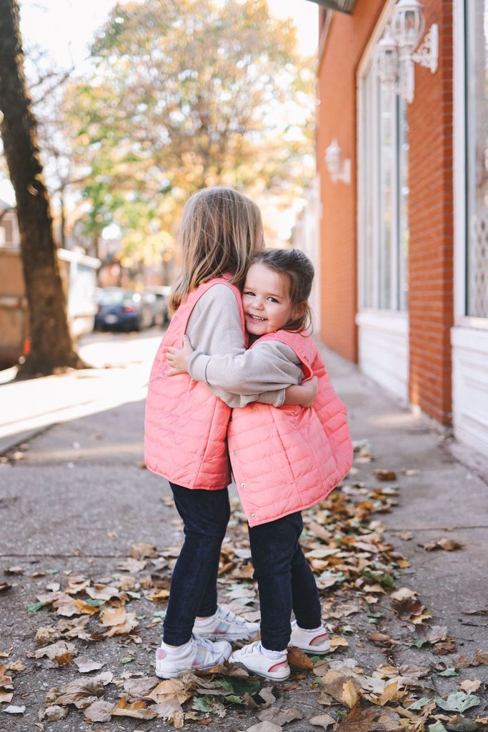 kids in matching puffer vests