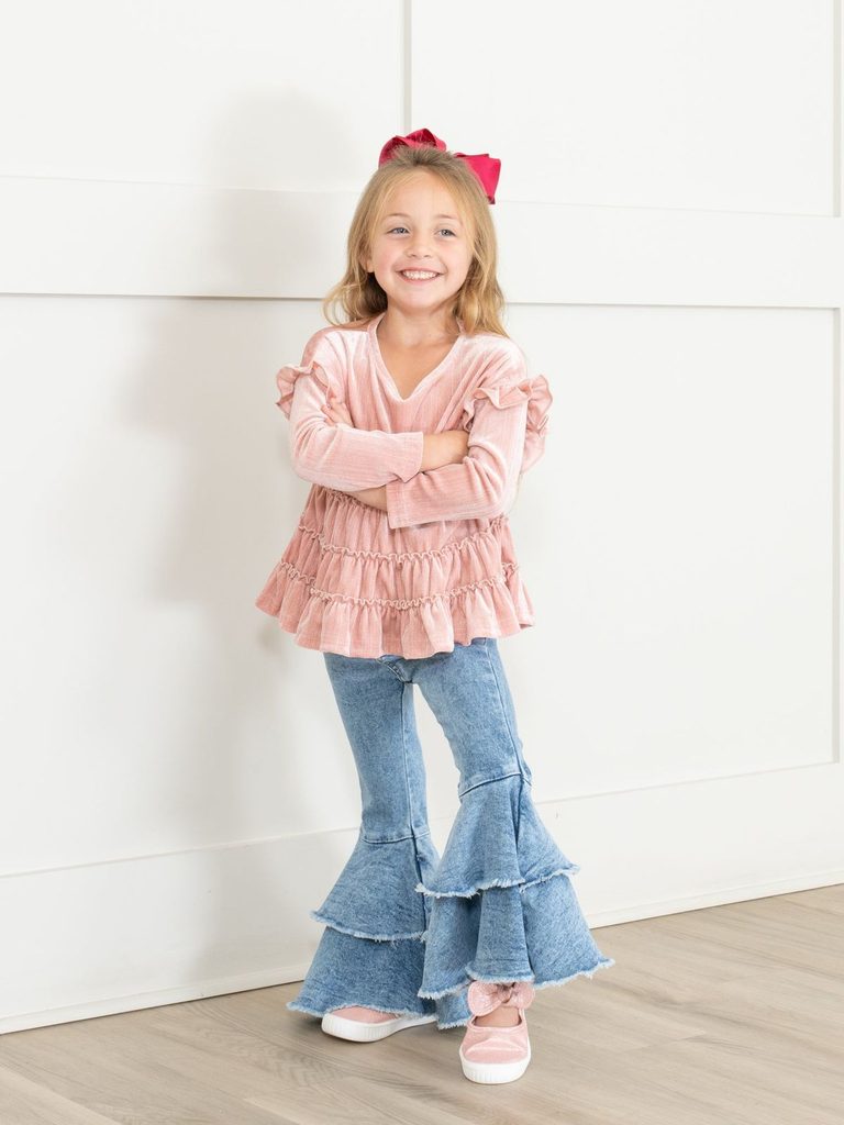 kid in flare jeans with fitted blouse as jeans outfit ideas for little girls