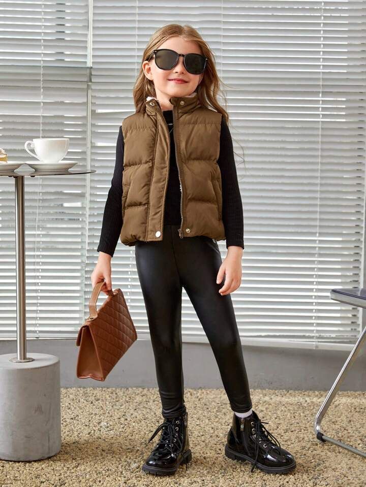 kid in leggings with puffer vest as stylish outfit ideas for active kids