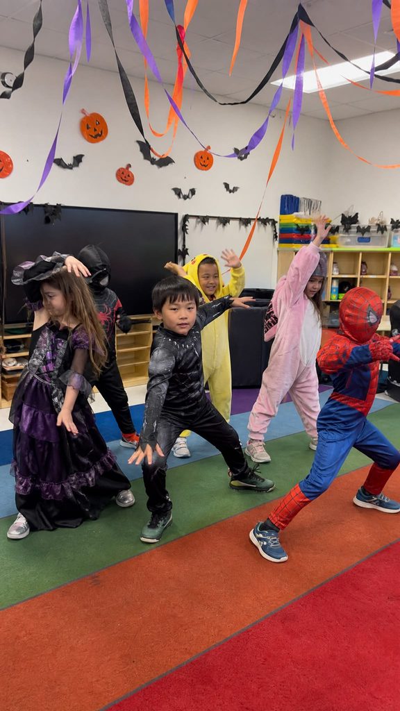 kids dancing freeze dance to spooky music as one of halloween games for kids