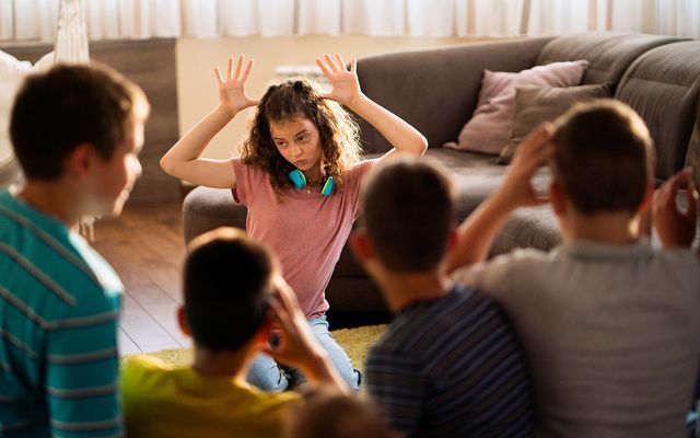 teens playing halloween charades game
