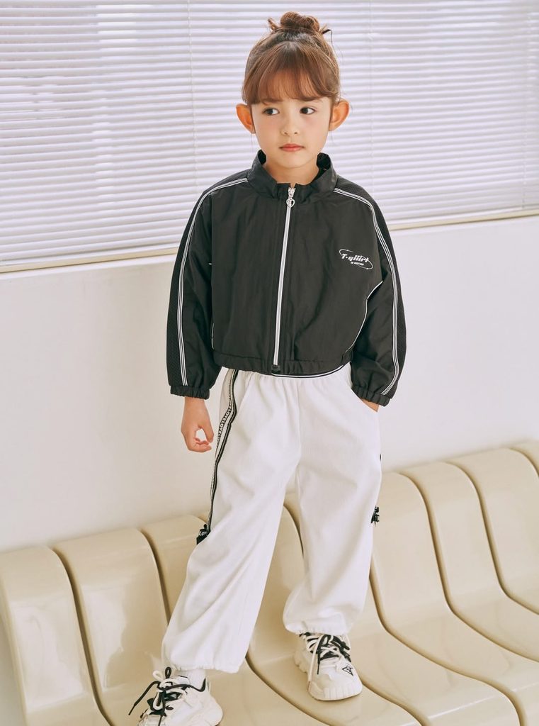 kid in joggers with zip-up athletic jacket as stylish outfit ideas for active kids