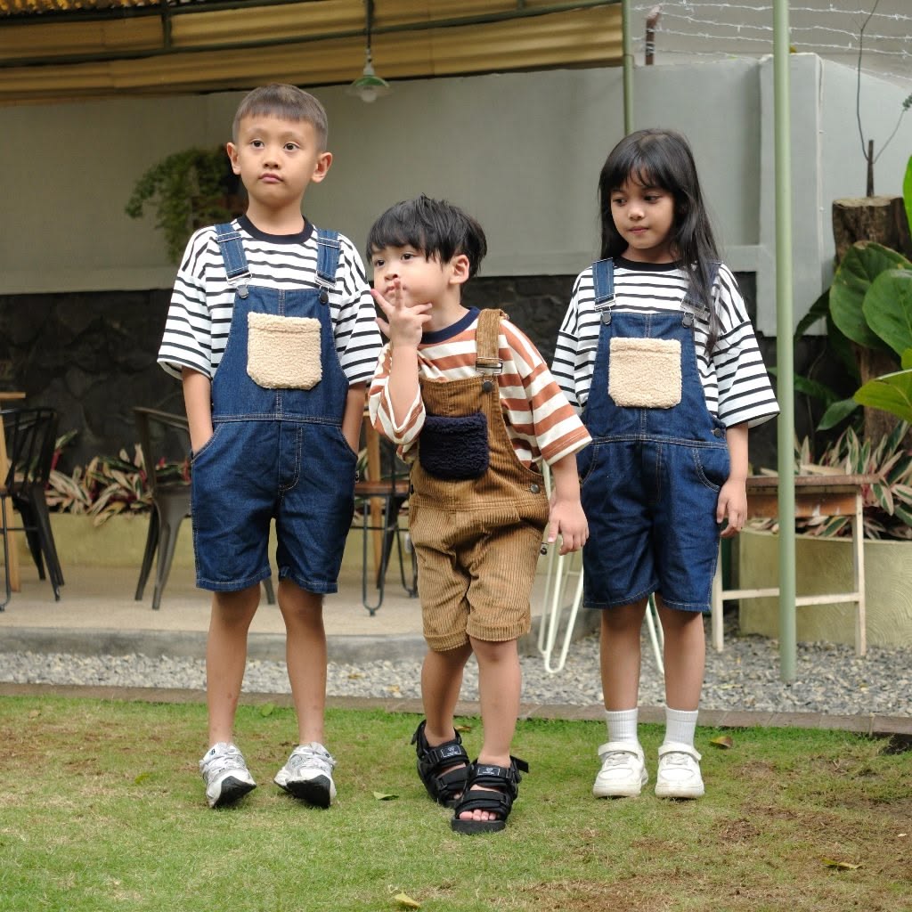 kids in matching overalls with tops