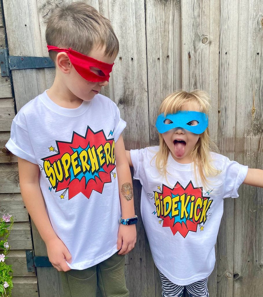 kids in matching super hero tee as matching outfit ideas for siblings