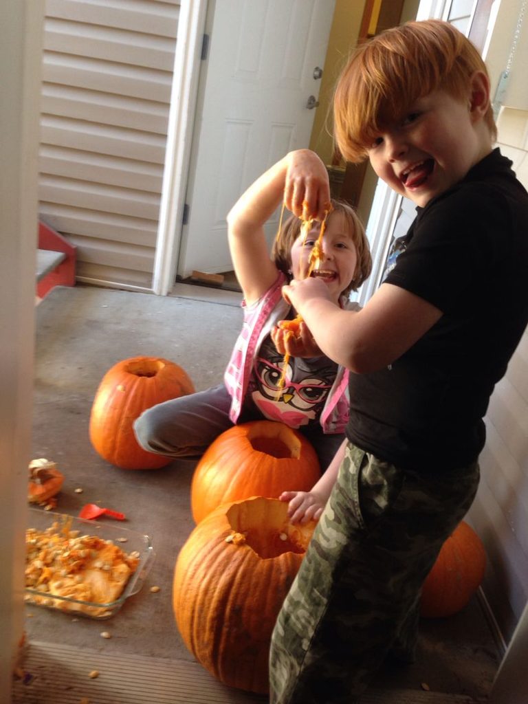 kids spitting pumpkin seed