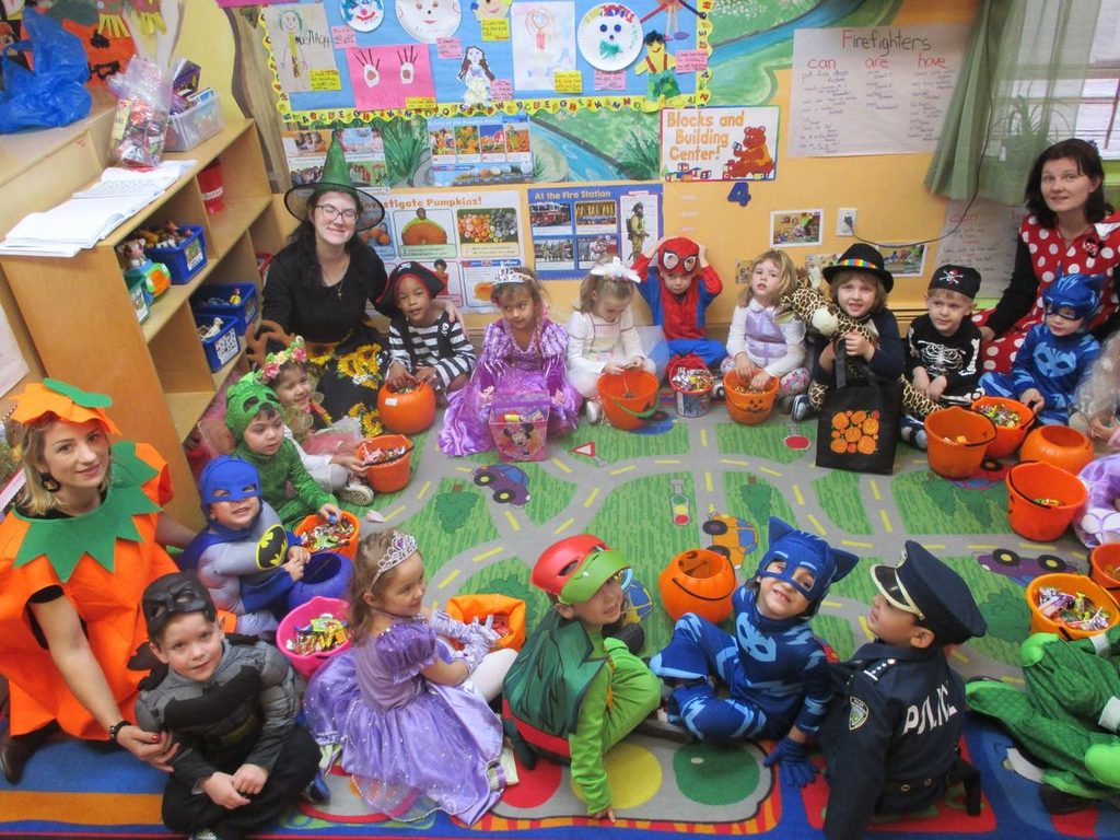 kids sitting in circle as one of halloween school party ideas