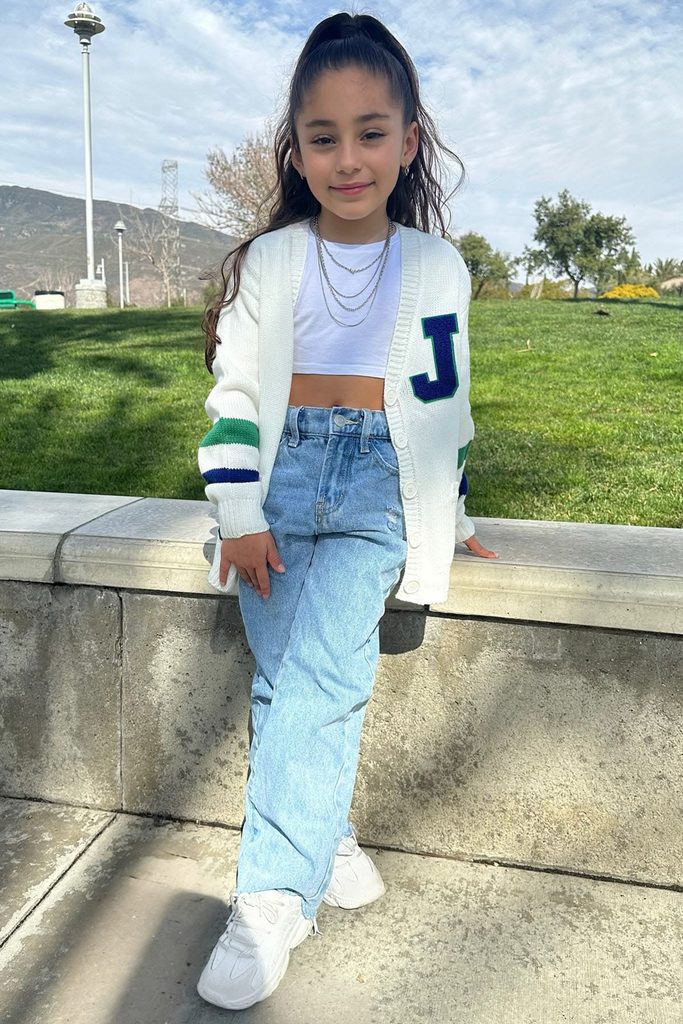 kid in Straight-Leg Jeans with a Chunky Cardigan